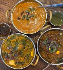 Tilak signature dishes Tandoori Chicken TikkaButter ChickenChicken Tikka Masala